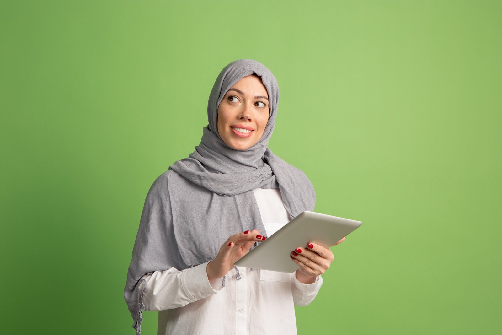 Happy Arab Woman In Hijab. Portrait Of Smiling Girl, Posing At Studio Background